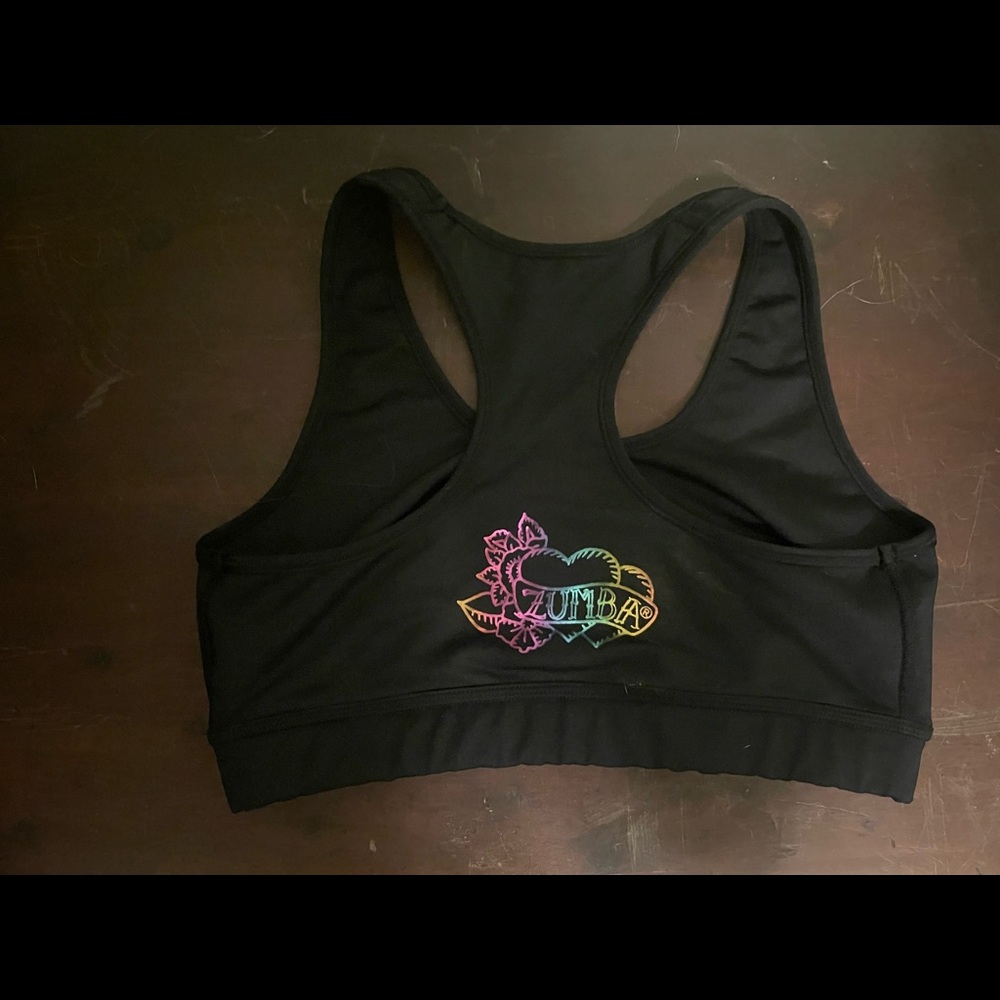 Zumba sports bra. Size large (lovely). Black with colorful images.